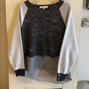 Grey sweatshirt with black detailing.